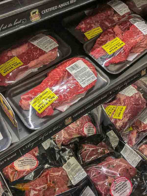 Packaged cuts of beef in a meat case.