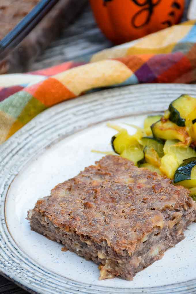 Special K Loaf on a plate with a side of sauteed zucchini