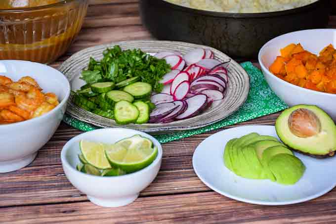 a spread of a vegetables in serving bowls