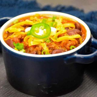 Beef Chili in a serving bowl with chili toppings