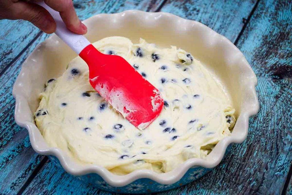 Spreading the coffee cake batter in the baking dish