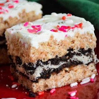 Oreo Stuffed Rice Krispie Treats on a red plate with a green napkin