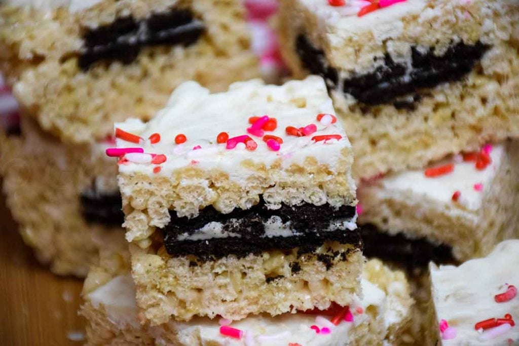 Oreo Stuffed Rice Krispie Treats Stacked on a cutting board