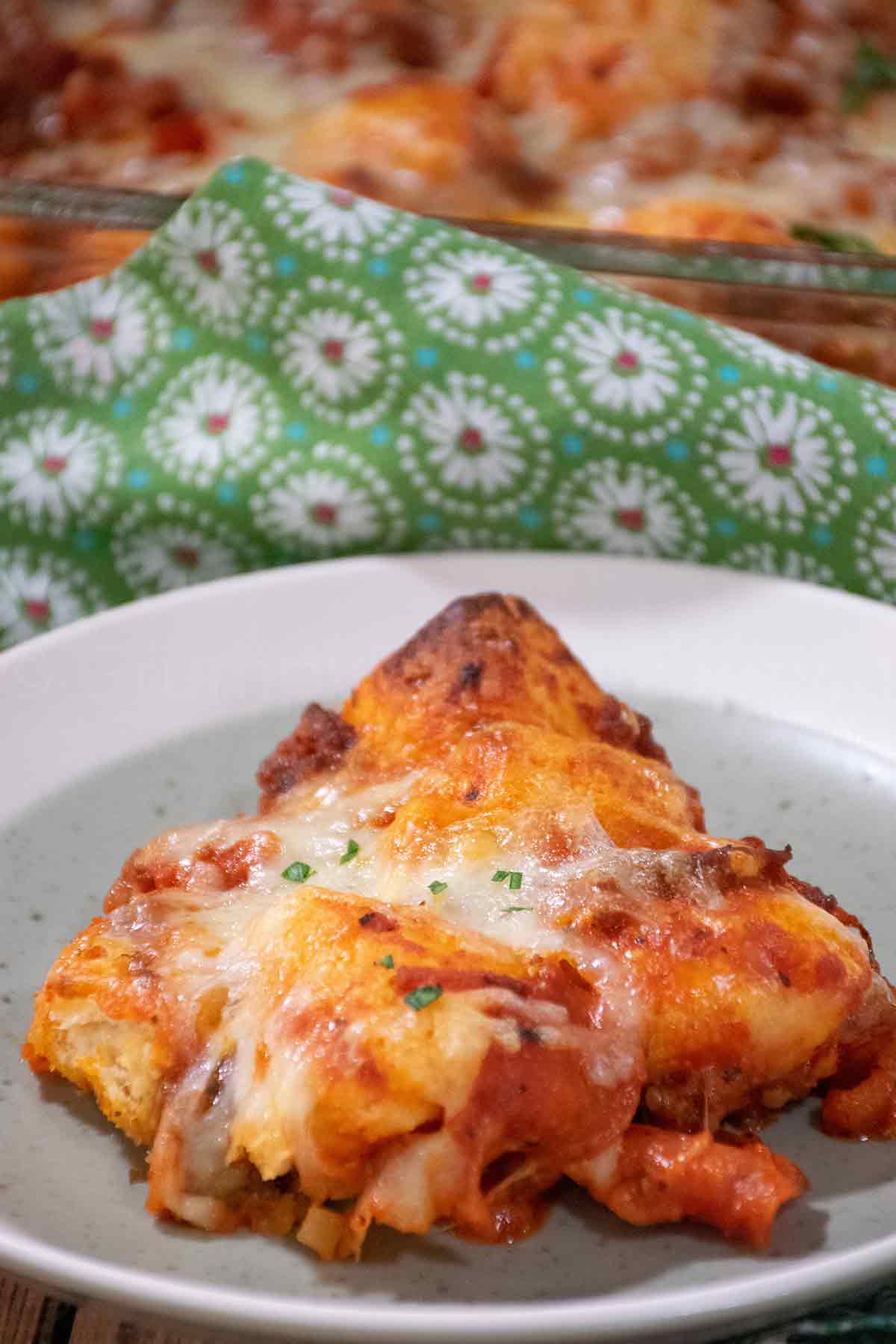 Bubble Up Pizza Casserole serving on a white plate.