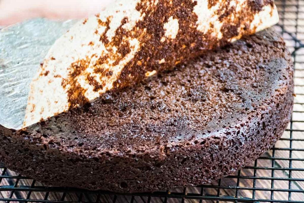 Peeling the parchment off the bottom of the cake