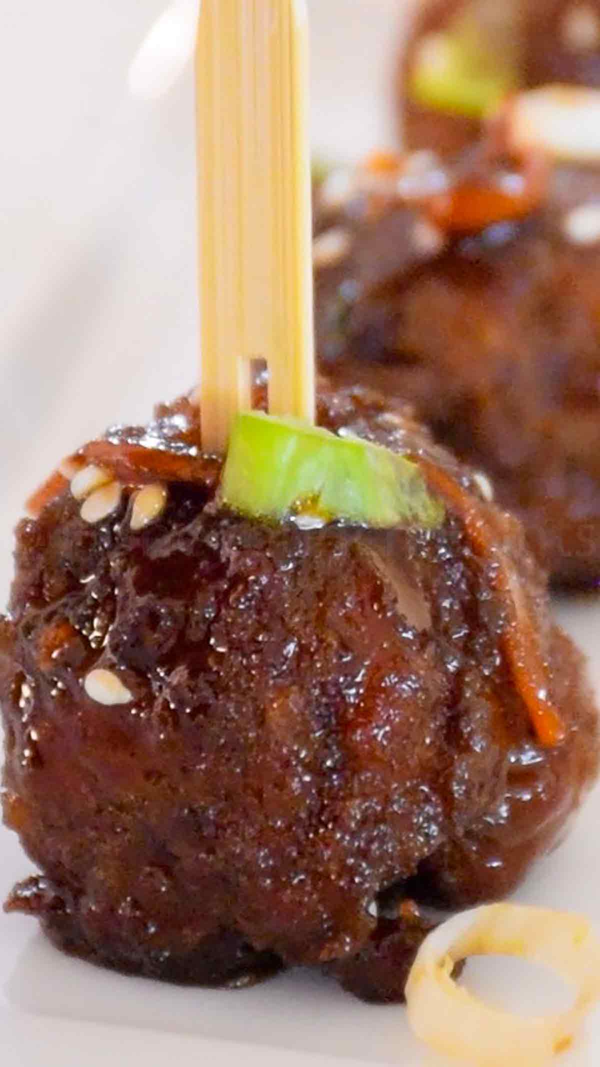 Upclose image of Mongolian Meatballs on a white plate.