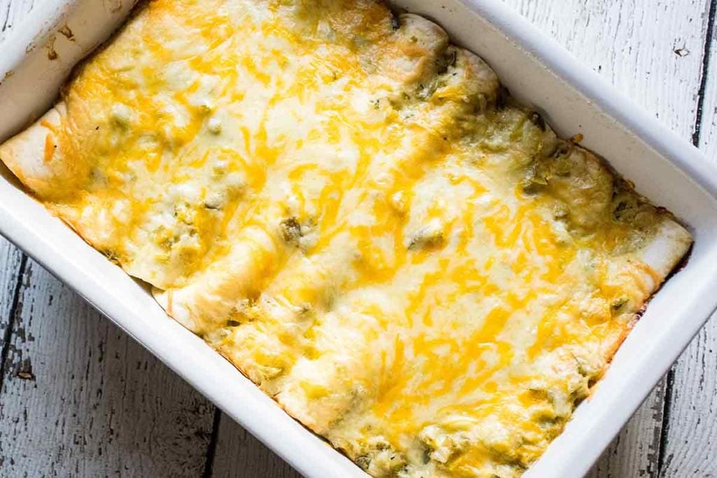 Baked green chicken enchilada recipe in a casserole dish.