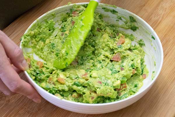 mixing all of the ingredients together in a bowl 