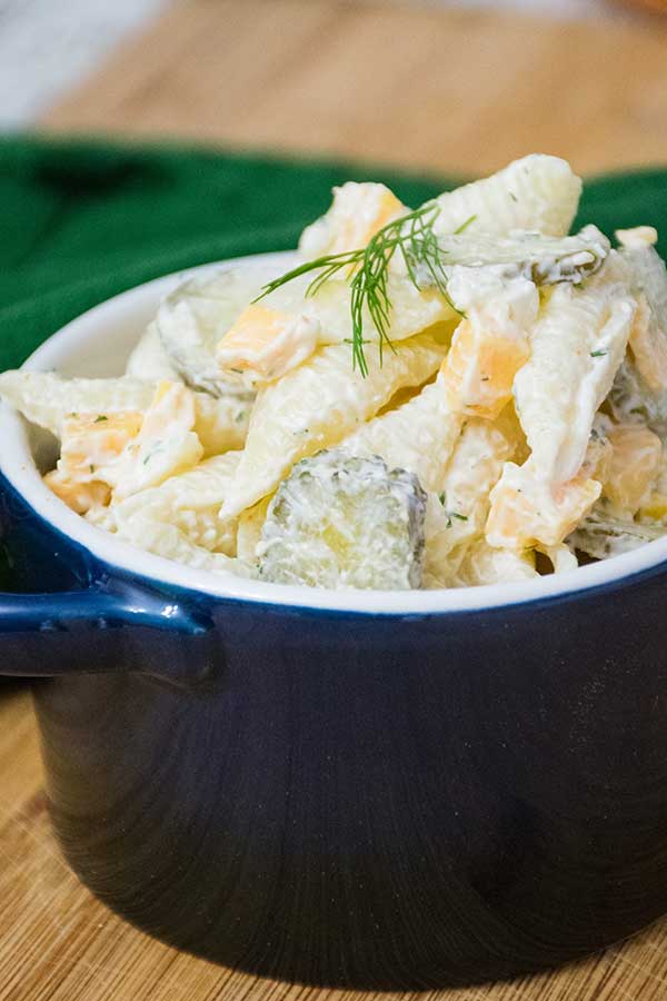 Dill Pickle Pasta Salad in a blue serving bowl