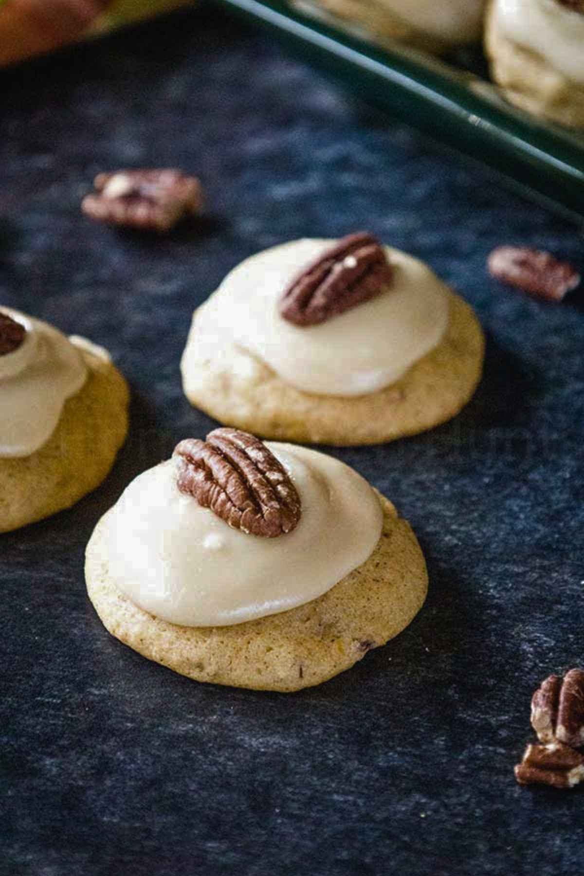 Angled view of butternut squash cookies on a serving tray.