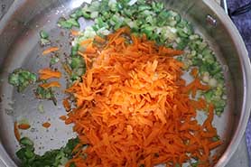 peppers and carrots in skillet