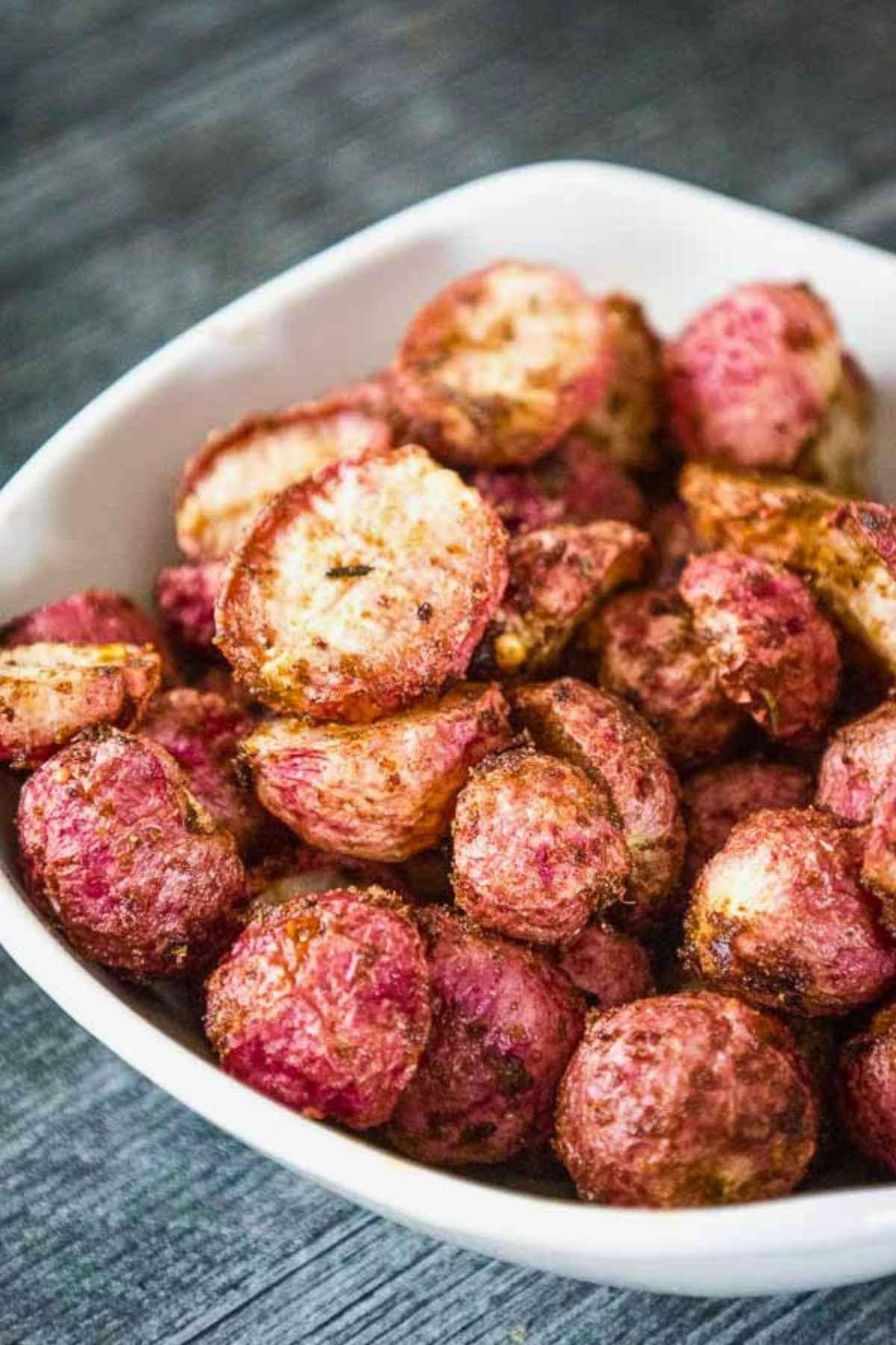 Oven Roasted Radishes in a white serving bowl.