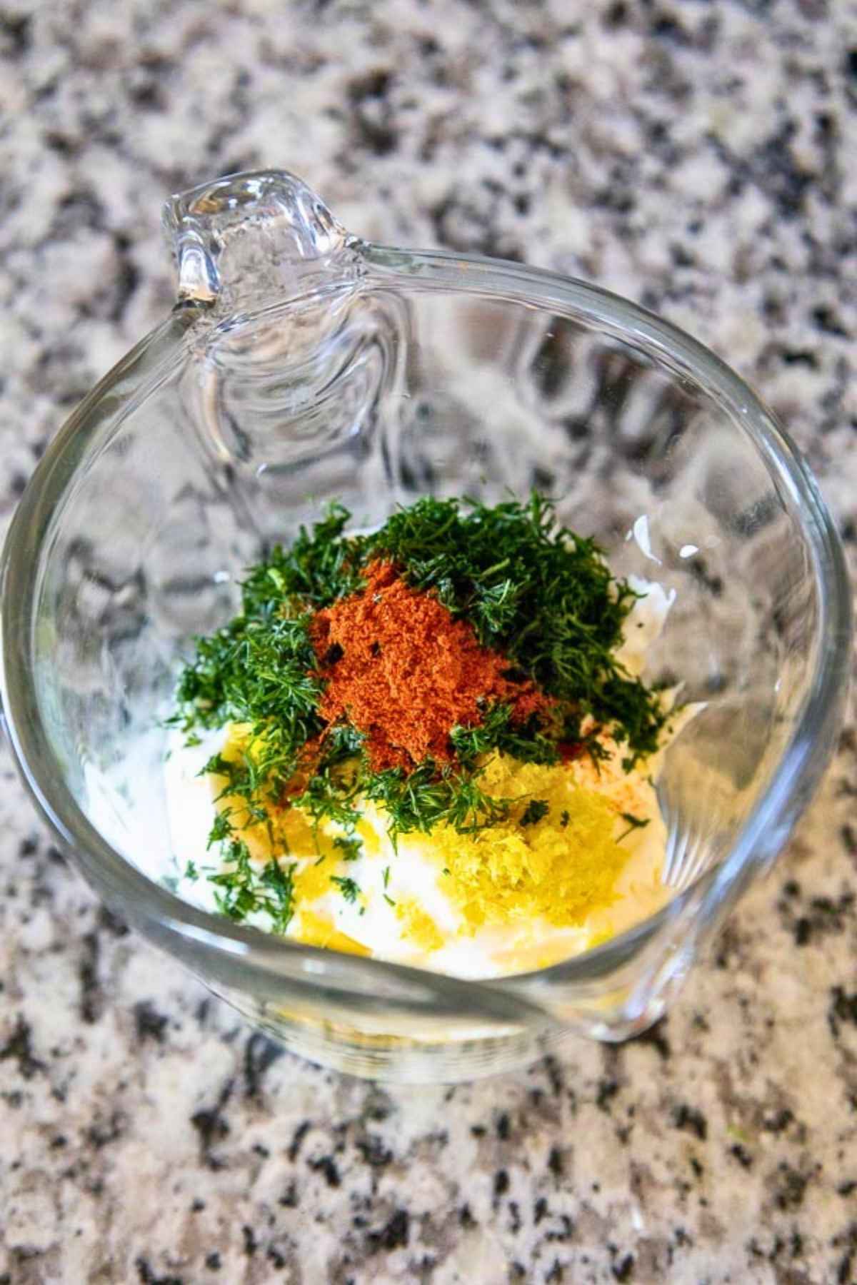 Sauce ingredients in a glass measuring cup.
