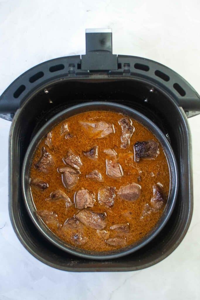 Cooked beef in sauce in air fryer.