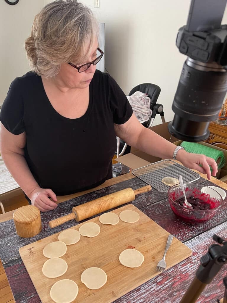 Shelby Law Ruttan behind the scenes filming a test recipe.