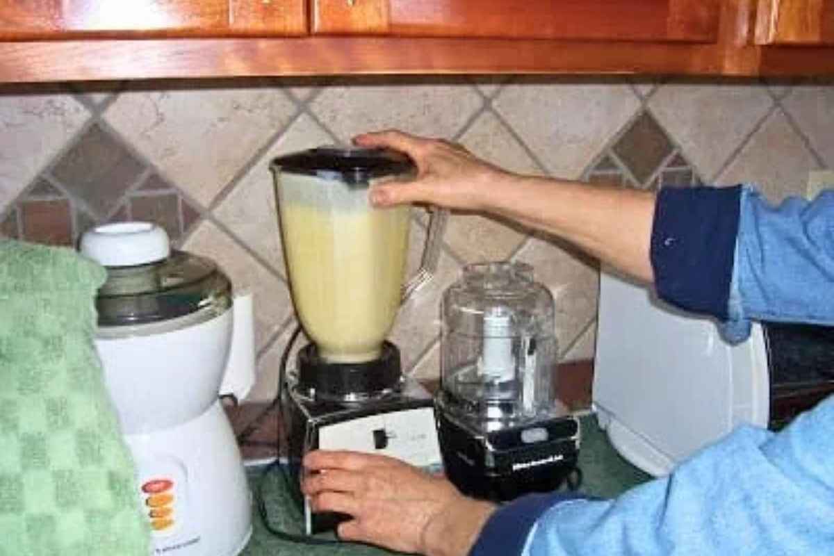 Using a blender to mix together the liquids.