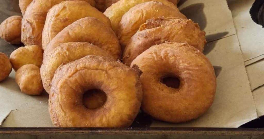 Mom's Buttermilk Donuts on a paper lined cookie sheet.