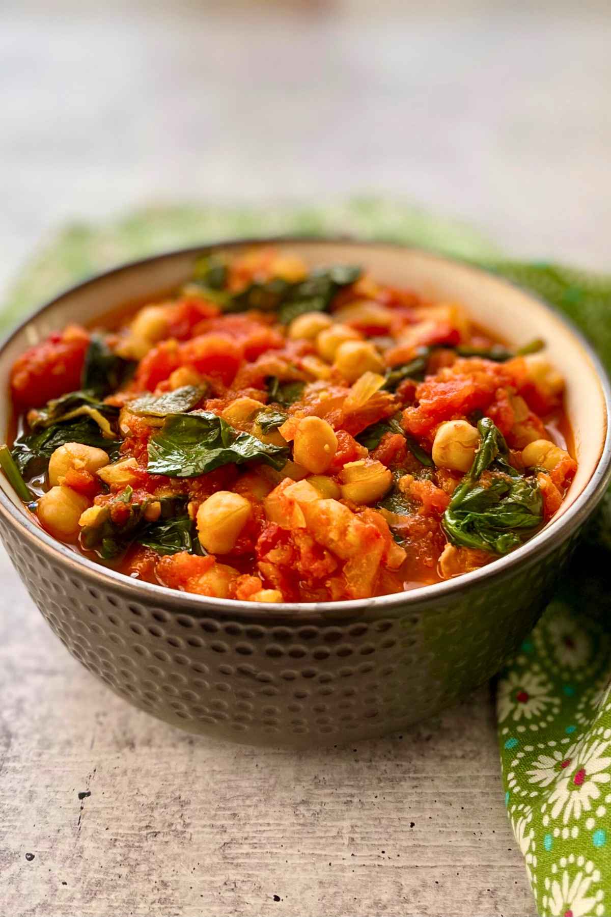 Chickpea and Spinach Curry in a brown bowl.