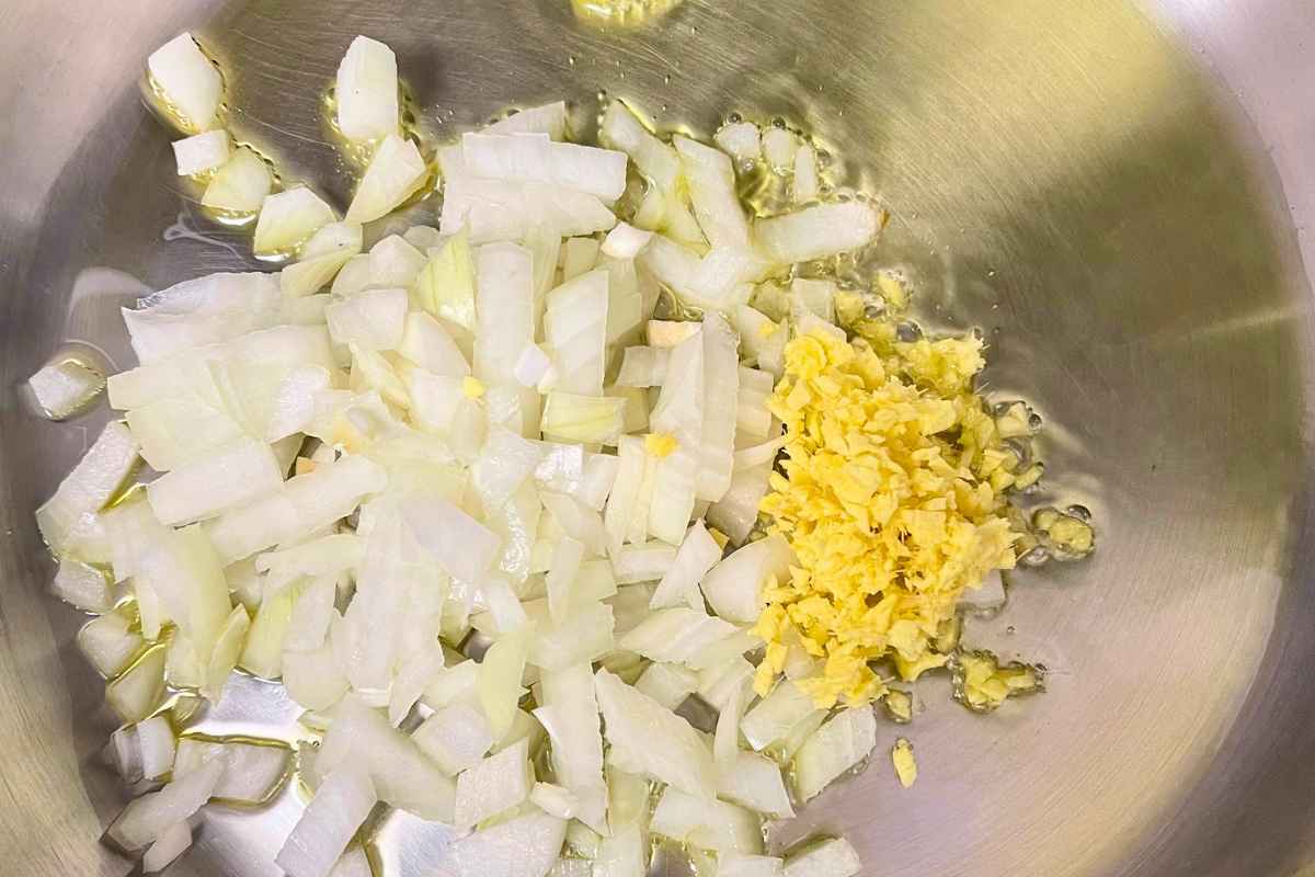Onions, garlic, and ginger sautéing in oil.