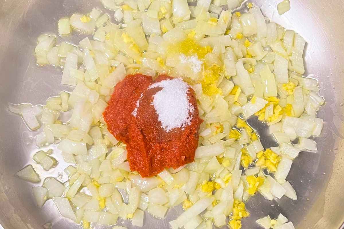 Curry and salt added to sauted onion mixture.
