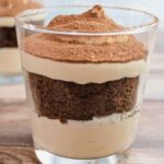 Upclose image of keto tiramisu in a clear glass.