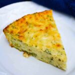 Crustless Broccoli Quiche wedge on a plate.