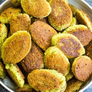 A white bowl filled with crispy, golden-brown homemade falafel patties.