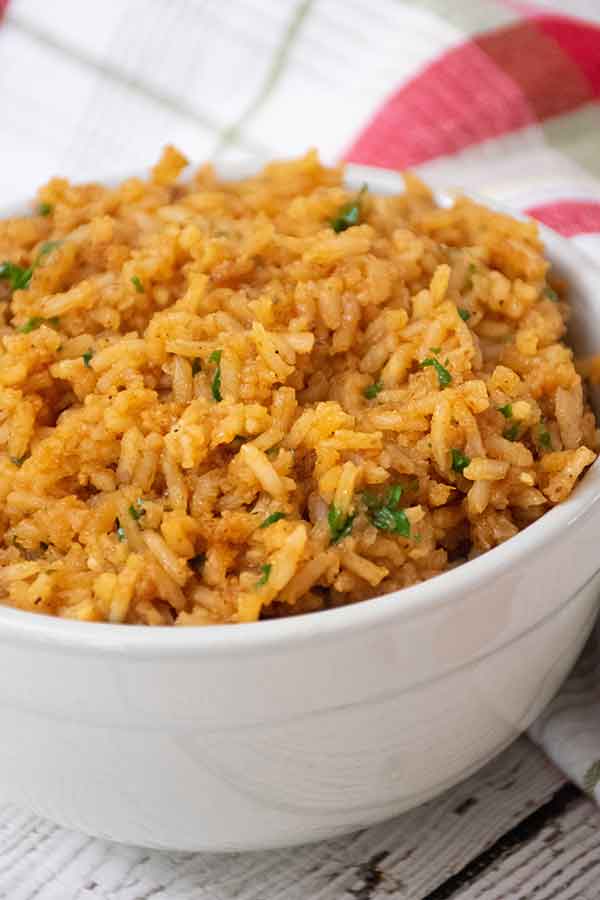 A white bowl filled with fluffy Spanish rice.