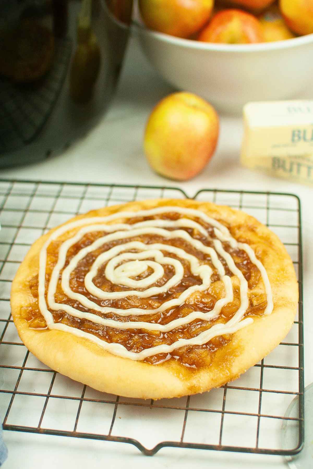 Angled view of caramel apple dessert pizza.
