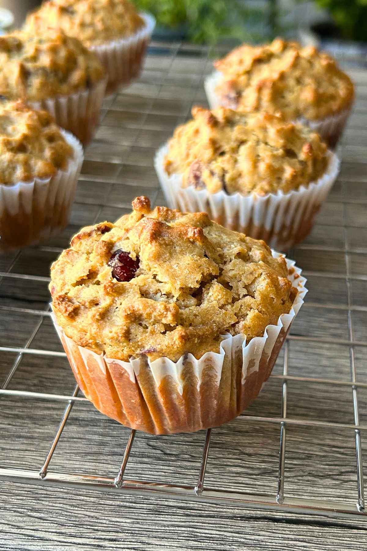 All bran muffins on a cooling rack.