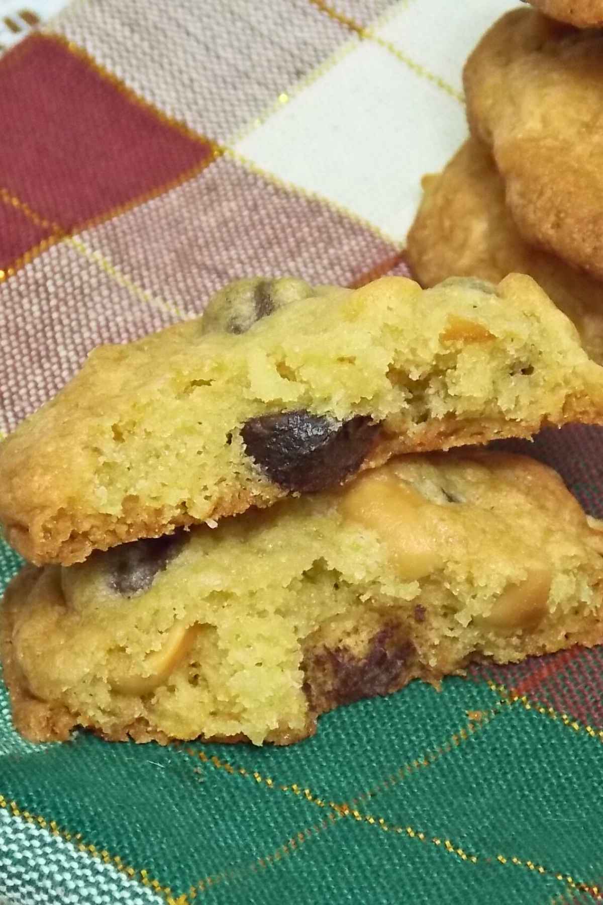 Salty sweet cookies that has been broken in half and stacked on top of each other so you can see the inside of the cookie.