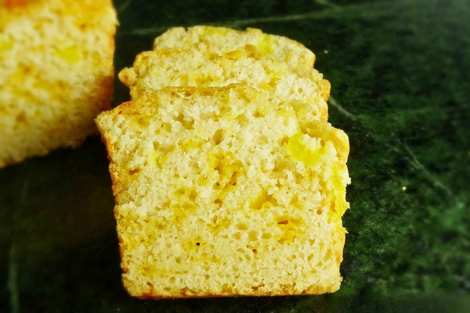 Close up of sliced Beer Cheese Bread highlighting the cheesy texture and golden crust.
