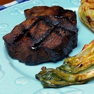 One marinated and grilled venison tenderloin steak.
