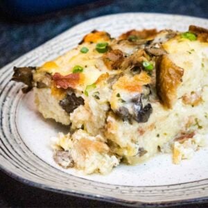 One serving mushroom strata on a cream colored plate.