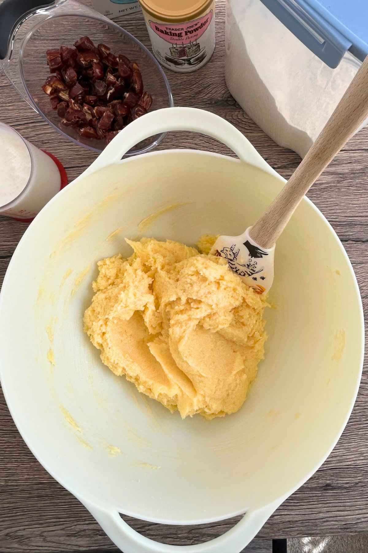 Creamed butter, sugar, eggs, and vanilla in a mixing bowl.