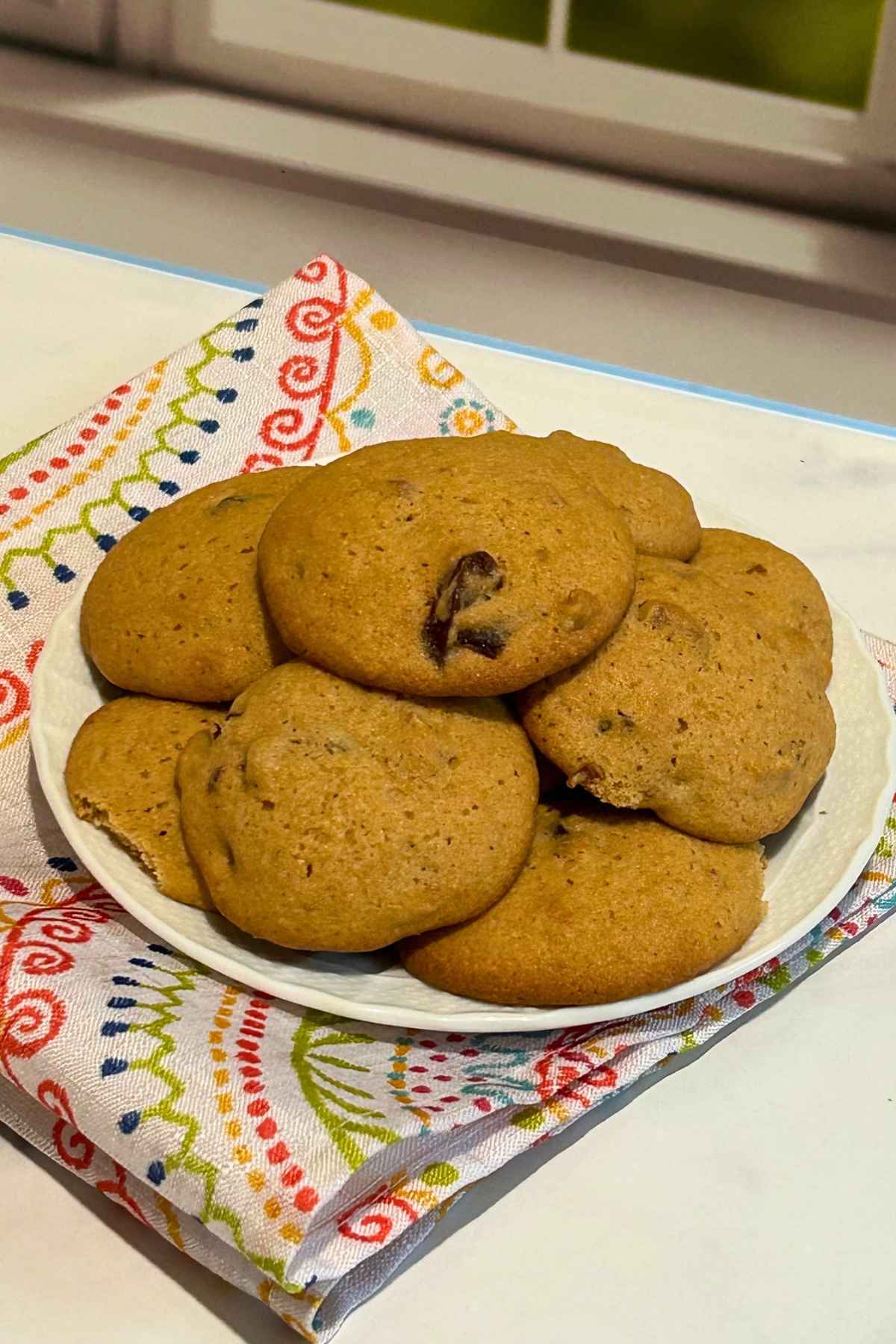 A plate full of date nut cookies.